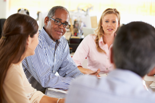 image of people sitting together at a meeting