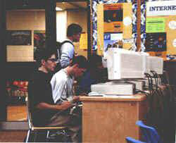 Students at computers in old library